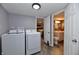 Convenient laundry area with modern washer and dryer, adjacent to a bathroom at 335 Park St, Noblesville, IN 46060