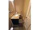 Cozy half-bathroom featuring granite countertops, sleek fixtures and hardwood flooring at 336 N Windsong Ln, Greenwood, IN 46142