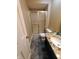 Bathroom with granite countertop, stainless faucet, shower stall, and tile floor at 336 N Windsong Ln, Greenwood, IN 46142