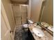 Bathroom with granite countertop, stainless faucet, shower stall, and tile floor at 336 N Windsong Ln, Greenwood, IN 46142