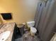 Bathroom features a granite countertop, a stainless steel trash can, and dark gray tiled flooring at 336 N Windsong Ln, Greenwood, IN 46142
