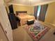 Bedroom features a large bed with orange and white patterned bedding and light brown walls at 336 N Windsong Ln, Greenwood, IN 46142