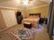 Bedroom with large bed, ceiling fan, and a colorful area rug at 336 N Windsong Ln, Greenwood, IN 46142