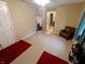 Bedroom featuring tan walls, carpeted floor, a full length mirror and a leather chair at 336 N Windsong Ln, Greenwood, IN 46142