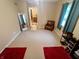 Bedroom featuring tan walls, carpeted floor, a full length mirror and a leather chair at 336 N Windsong Ln, Greenwood, IN 46142