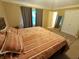 Bedroom features a large bed, carpeted floor, and neutral colored walls at 336 N Windsong Ln, Greenwood, IN 46142