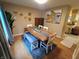 Modern dining room with rustic wood table, bench seating, and stylish decor create an inviting atmosphere at 336 N Windsong Ln, Greenwood, IN 46142