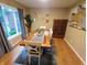 Bright dining room featuring a live edge wood table, modern decor, and large window at 336 N Windsong Ln, Greenwood, IN 46142