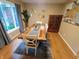 Bright dining room featuring a live edge wood table, modern decor, and large window at 336 N Windsong Ln, Greenwood, IN 46142