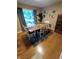 Bright dining area with wooden table, unique gold wall decor, and natural light at 336 N Windsong Ln, Greenwood, IN 46142