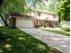 Charming two-story home with a well-maintained lawn, a two-car garage, and classic brick accents at 336 N Windsong Ln, Greenwood, IN 46142