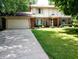 Well-kept two-story home with a two-car garage, neat landscaping, and a welcoming facade at 336 N Windsong Ln, Greenwood, IN 46142