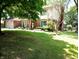 Charming brick home with well-manicured lawn and beautiful landscaping creates an inviting curb appeal at 336 N Windsong Ln, Greenwood, IN 46142