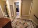 Hallway between staircase and bedrooms with decorative rug leads to the bathroom and another bedroom at 336 N Windsong Ln, Greenwood, IN 46142