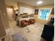 Bright kitchen with tan countertops, white cabinets, and comfortable seating space for friends or Gathering at 336 N Windsong Ln, Greenwood, IN 46142