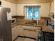 Efficient kitchen features granite countertops, stainless steel appliances, and ample cabinet space at 336 N Windsong Ln, Greenwood, IN 46142