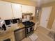Bright kitchen featuring stainless appliances, granite counters and hardwood floors at 336 N Windsong Ln, Greenwood, IN 46142