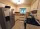 Efficient kitchen features granite countertops, stainless steel appliances, and ample cabinet space at 336 N Windsong Ln, Greenwood, IN 46142