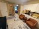 Bright kitchen with white cabinets and tan counter tops, and comfortable seating area at 336 N Windsong Ln, Greenwood, IN 46142