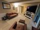 A cozy living room with a leather couch, electric fireplace, and sliding doors to the backyard at 336 N Windsong Ln, Greenwood, IN 46142