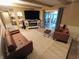 Comfortable living room with a large TV, an electric fireplace, and sliding door to an outdoor patio at 336 N Windsong Ln, Greenwood, IN 46142