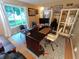 Home office with a large desk, decor, and a comfortable chair, bathed in natural light from a nearby window at 336 N Windsong Ln, Greenwood, IN 46142