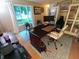 Home office featuring a spacious desk, decor, and two chairs, illuminated by natural light from a nearby window at 336 N Windsong Ln, Greenwood, IN 46142