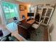 Office area with a large desk, cabinets, and natural light through a large window at 336 N Windsong Ln, Greenwood, IN 46142