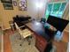 Office space boasting an executive desk, modern chair, and a view from the nearby window at 336 N Windsong Ln, Greenwood, IN 46142