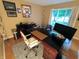 Well-appointed office featuring a desk, modern chair, and natural light from a nearby window at 336 N Windsong Ln, Greenwood, IN 46142