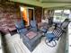 Inviting porch featuring a fire pit and lots of comfortable seating perfect for enjoying outdoor living at 336 N Windsong Ln, Greenwood, IN 46142