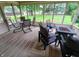 Relaxing screened-in porch featuring a fire pit and comfortable seating overlooking the landscaped backyard at 336 N Windsong Ln, Greenwood, IN 46142