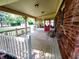 Charming porch has a red door, brick accents, and a cozy atmosphere at 336 N Windsong Ln, Greenwood, IN 46142