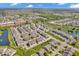 Overhead view of a meticulously planned townhome community with ponds, landscaping, and easy access to shopping at 3546 Brampton Ln, Westfield, IN 46074