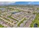 Aerial view of a modern townhome community, showcasing community ponds and a shopping center at 3546 Brampton Ln, Westfield, IN 46074