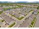 Aerial view of townhome community highlighting community layout, pond, and shopping centers in the distance at 3546 Brampton Ln, Westfield, IN 46074