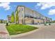 Rear exterior view of townhomes showing walk out basements, decks, patios, and manicured lawns at 3546 Brampton Ln, Westfield, IN 46074