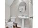 Elegant half bathroom featuring a pedestal sink, modern fixtures and commode at 3546 Brampton Ln, Westfield, IN 46074