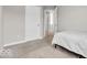 A minimalistic bedroom features neutral tones and a simple bed frame at 3546 Brampton Ln, Westfield, IN 46074