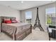 Cozy bedroom features an Eiffel Tower design, a comfortable bed, and natural light from two windows at 3546 Brampton Ln, Westfield, IN 46074