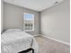 Simple bedroom with a single bed and ample natural light creates a peaceful and inviting space at 3546 Brampton Ln, Westfield, IN 46074