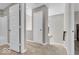 Upstairs hallway with multiple doors, including access to bathroom and bedroom at 3546 Brampton Ln, Westfield, IN 46074