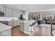 Kitchen with a large island, grey cabinetry, stainless steel appliances, and views into the living room area at 3546 Brampton Ln, Westfield, IN 46074