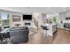 Open-concept living room featuring modern furniture and an electric fireplace at 3546 Brampton Ln, Westfield, IN 46074