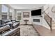 Comfortable living room featuring a fireplace, staircase, and a large window at 3546 Brampton Ln, Westfield, IN 46074