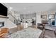 Open concept living room with a modern kitchen and a cozy fireplace at 3546 Brampton Ln, Westfield, IN 46074