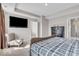 Tranquil main bedroom featuring a mounted TV, a seating area, and en suite bathroom at 3546 Brampton Ln, Westfield, IN 46074