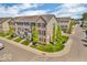 Street view of well-maintained townhomes featuring brick and siding exteriors with landscaped yards at 3546 Brampton Ln, Westfield, IN 46074