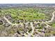 A beautiful aerial view of a neighborhood with a golf course and mature trees at 3559 Towne Dr, Carmel, IN 46032