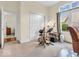 Neutral carpeted bedroom with a guitar, chair, and music stand bathed in natural light from large windows at 3559 Towne Dr, Carmel, IN 46032